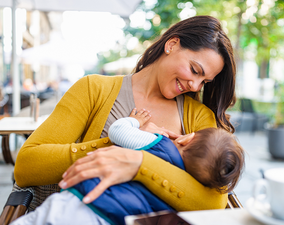 Woman breast feeding baby